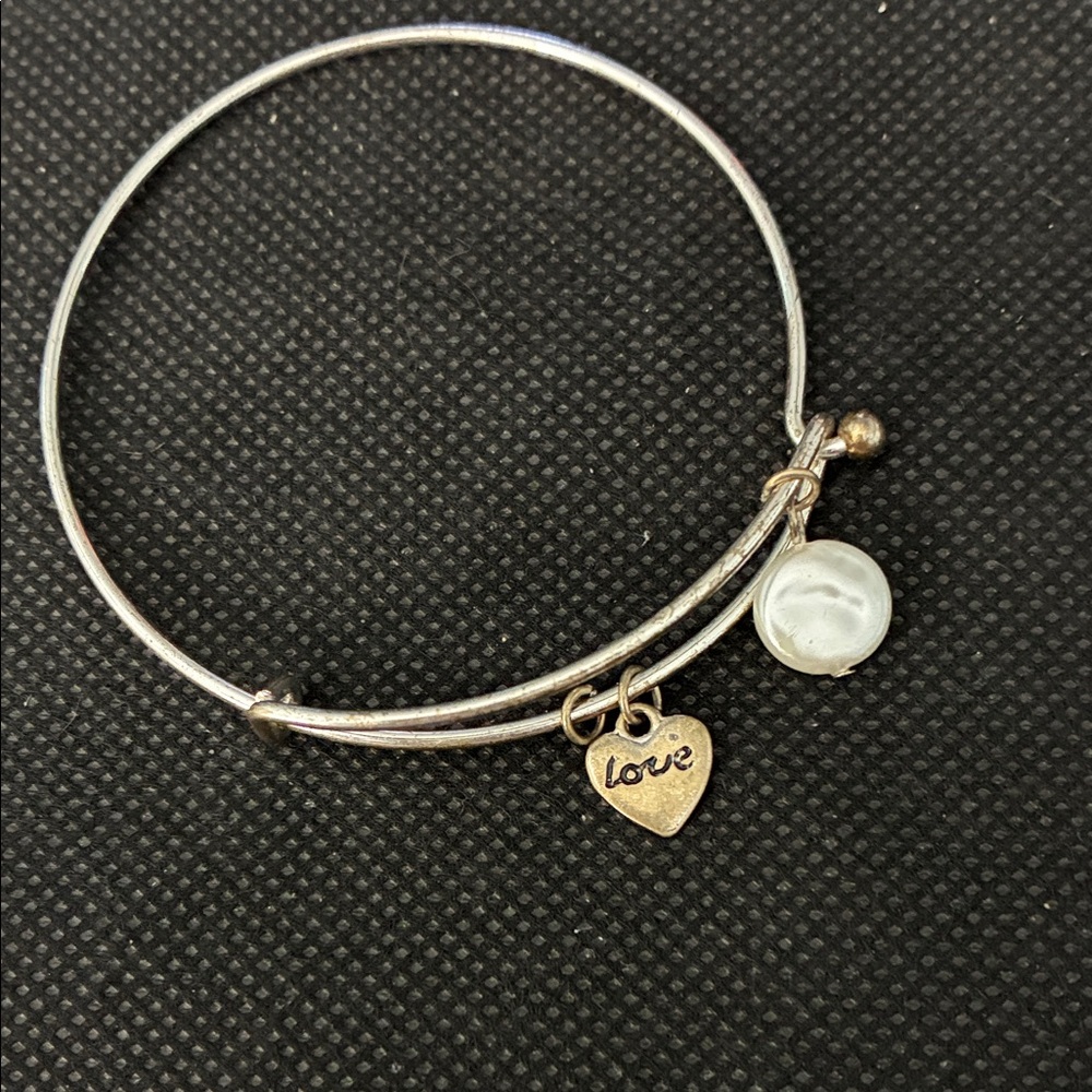 Custom wire wrap bracelet. Adjustable with spring opening.